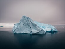 An iceberg in the middle of water