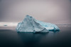 An iceberg in the middle of water